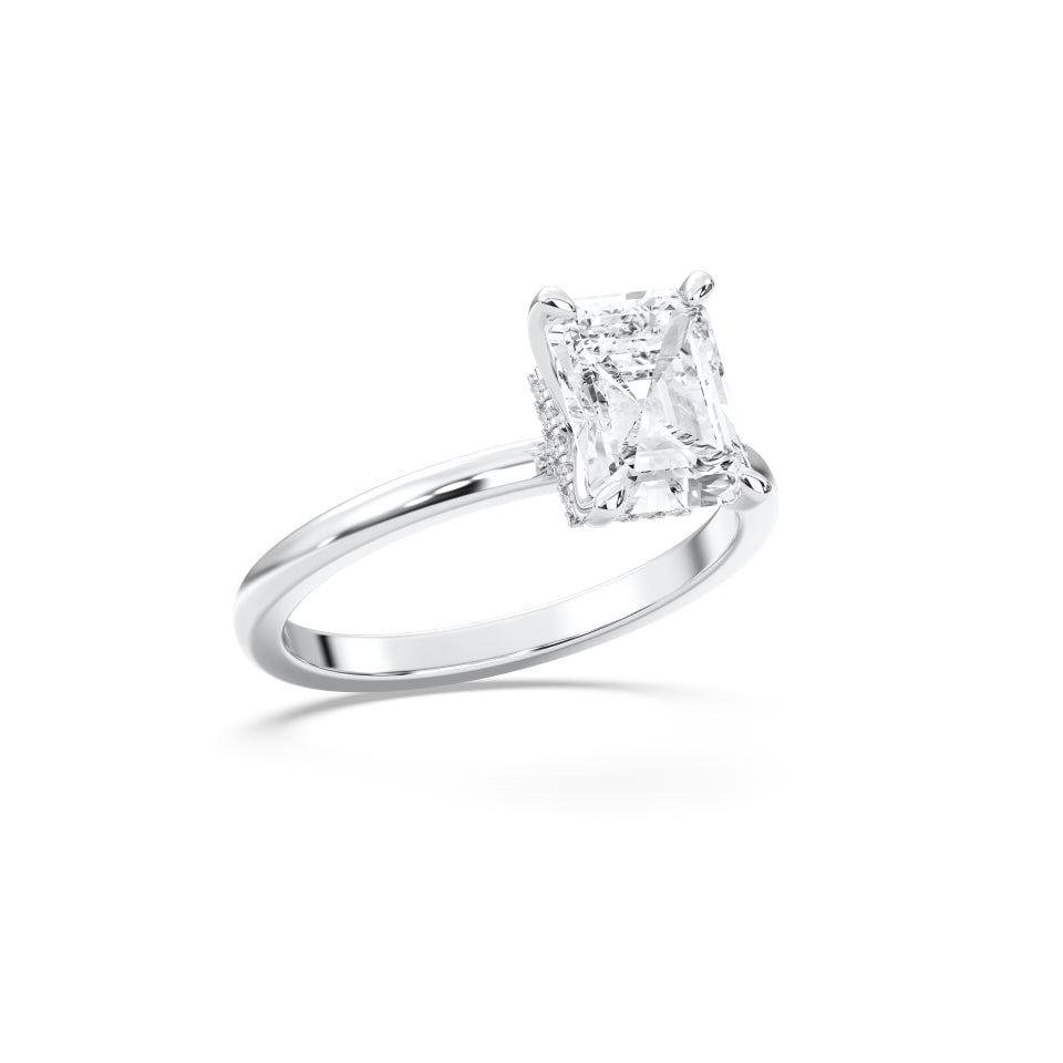 Hidden halo emerald ring